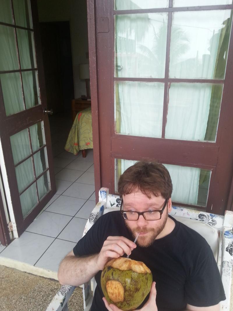 Drinking from a pineapple on the porch of our hotel room, Negril, Jamaica