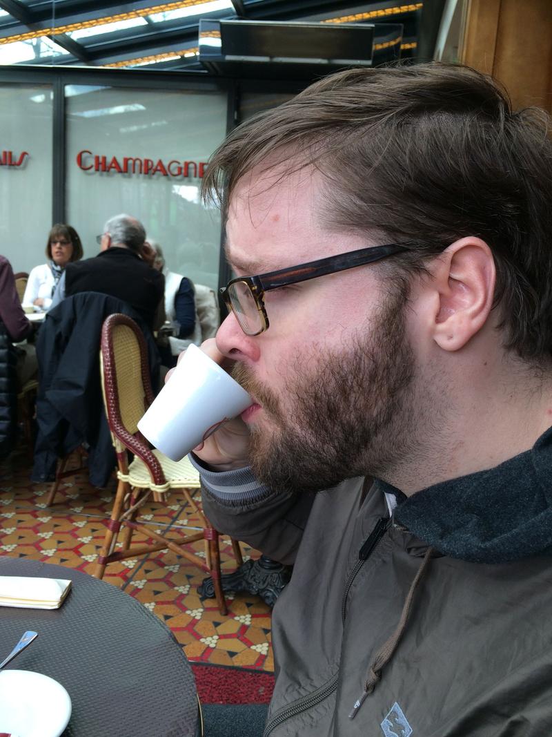 Enjoying espresso at George V Cafe on the Champs-Élysées, Paris, France