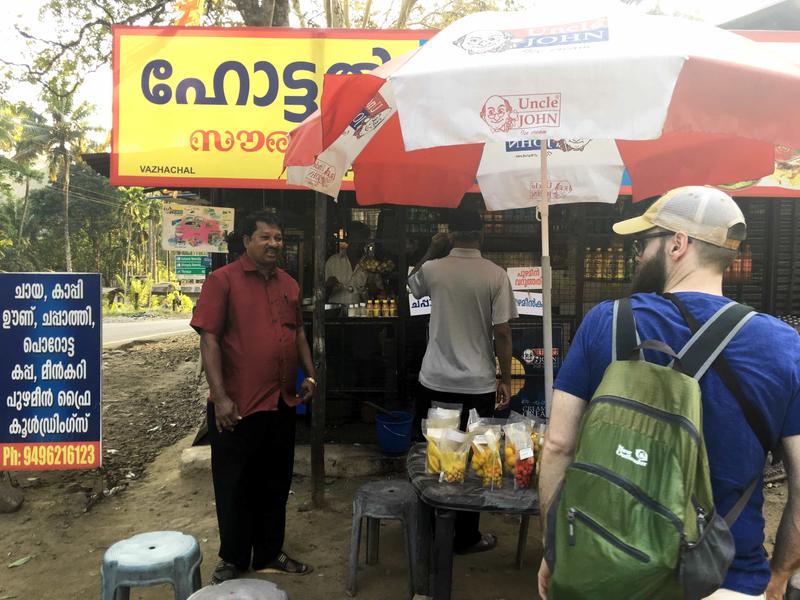 Kuttan, Father Xavier, and me getting tea at a stop by Vazhachal Waterfalls, Ernakulam, Kerala, India