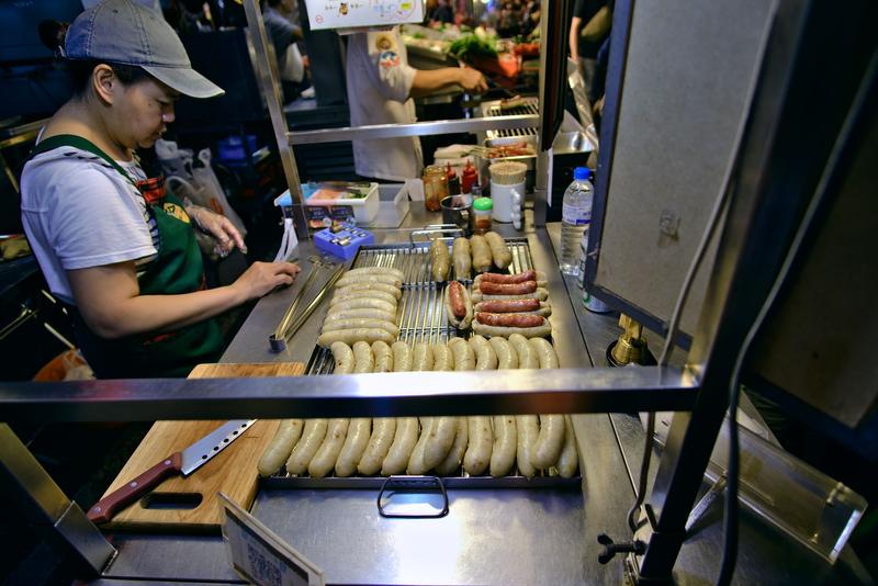 Taiwanese hot dog vendor at Liuhe Night Market, Kaosiung, Taiwan