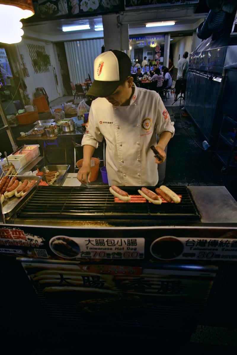 Taiwanese hot dog vendor at Liuhe Night Market, Kaosiung, Taiwan