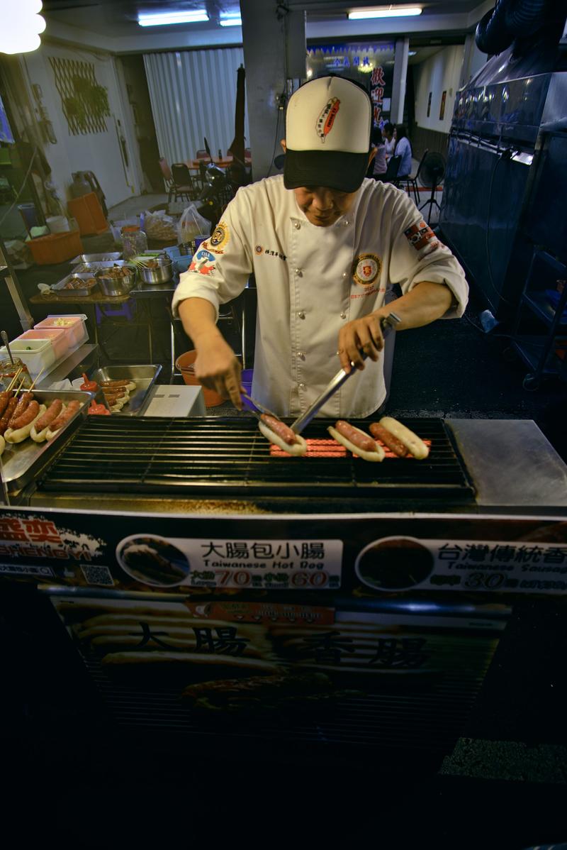 Taiwanese hot dog vendor at Liuhe Night Market, Kaosiung, Taiwan