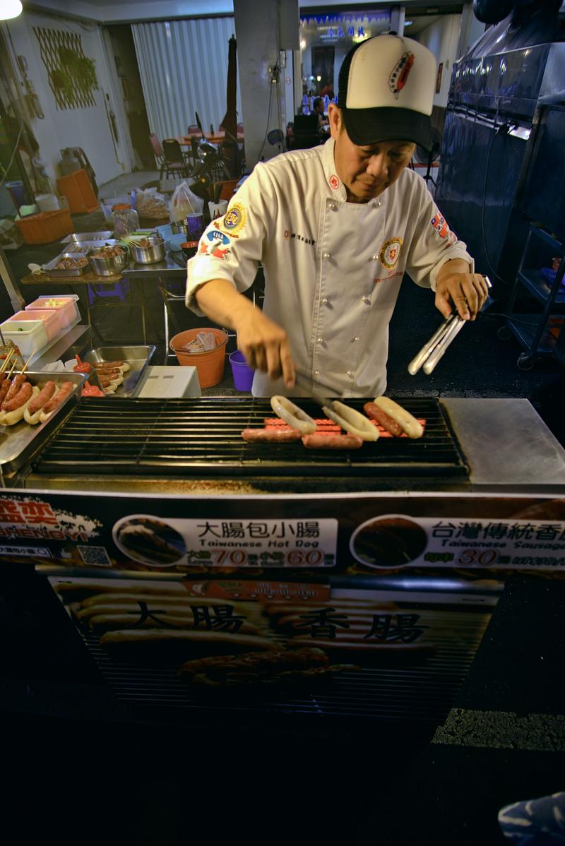 Taiwanese hot dog vendor at Liuhe Night Market, Kaosiung, Taiwan