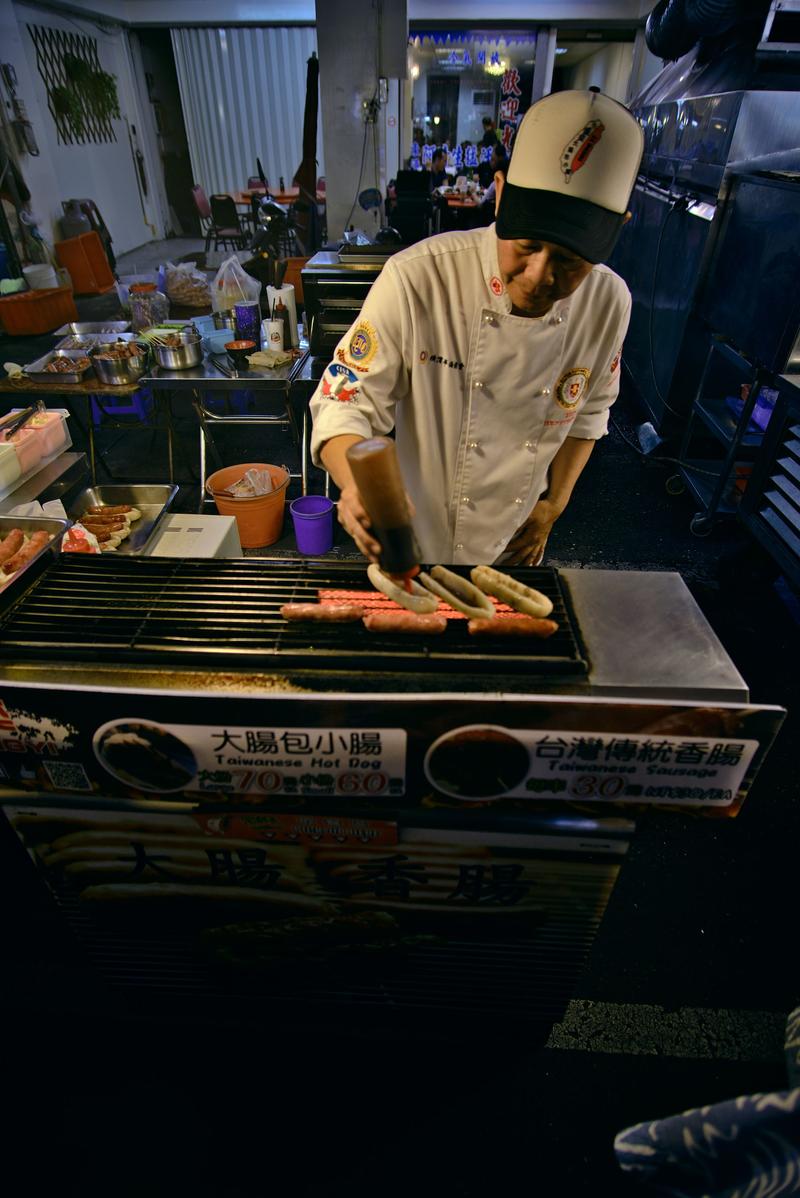 Taiwanese hot dog vendor at Liuhe Night Market, Kaosiung, Taiwan