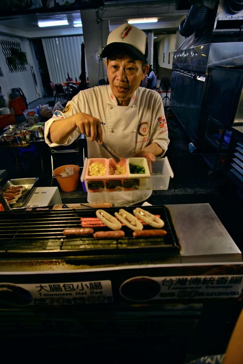 Taiwanese hot dog vendor at Liuhe Night Market, Kaosiung, Taiwan