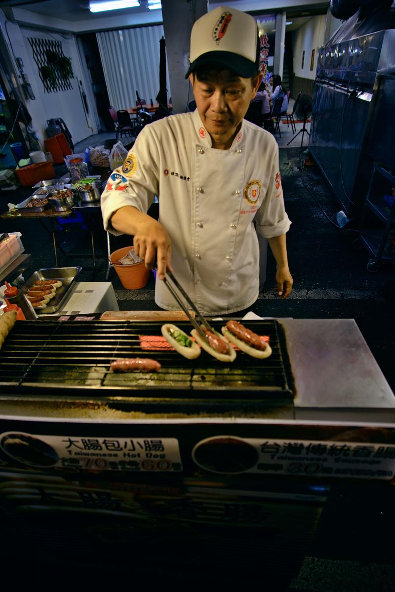 Taiwanese hot dog vendor at Liuhe Night Market, Kaosiung, Taiwan