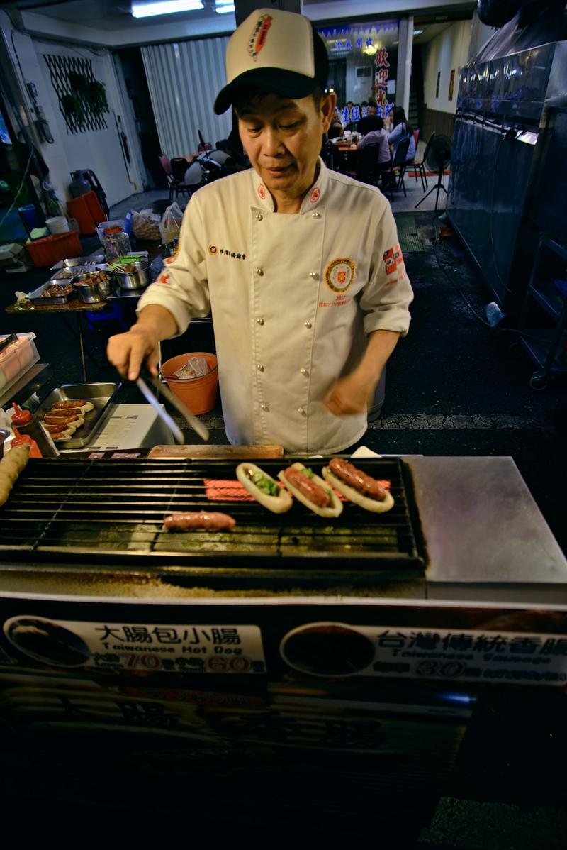 Taiwanese hot dog vendor at Liuhe Night Market, Kaosiung, Taiwan