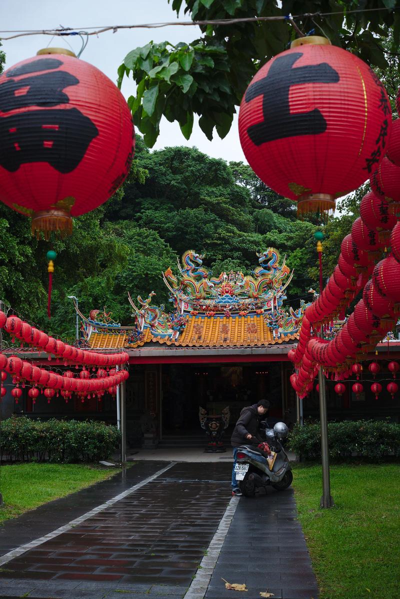 Temple on the side of a busy road Exploring Taipei, Taiwan