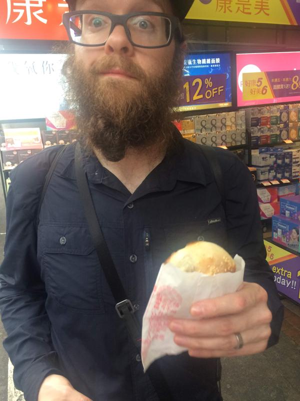 Eating Fuzhou Pepper Buns (pork pepper buns) at Roahe night market, Taipei, Taiwan. These were absolutely unbelievably delicious and one of our favorite food items of the entire trip.