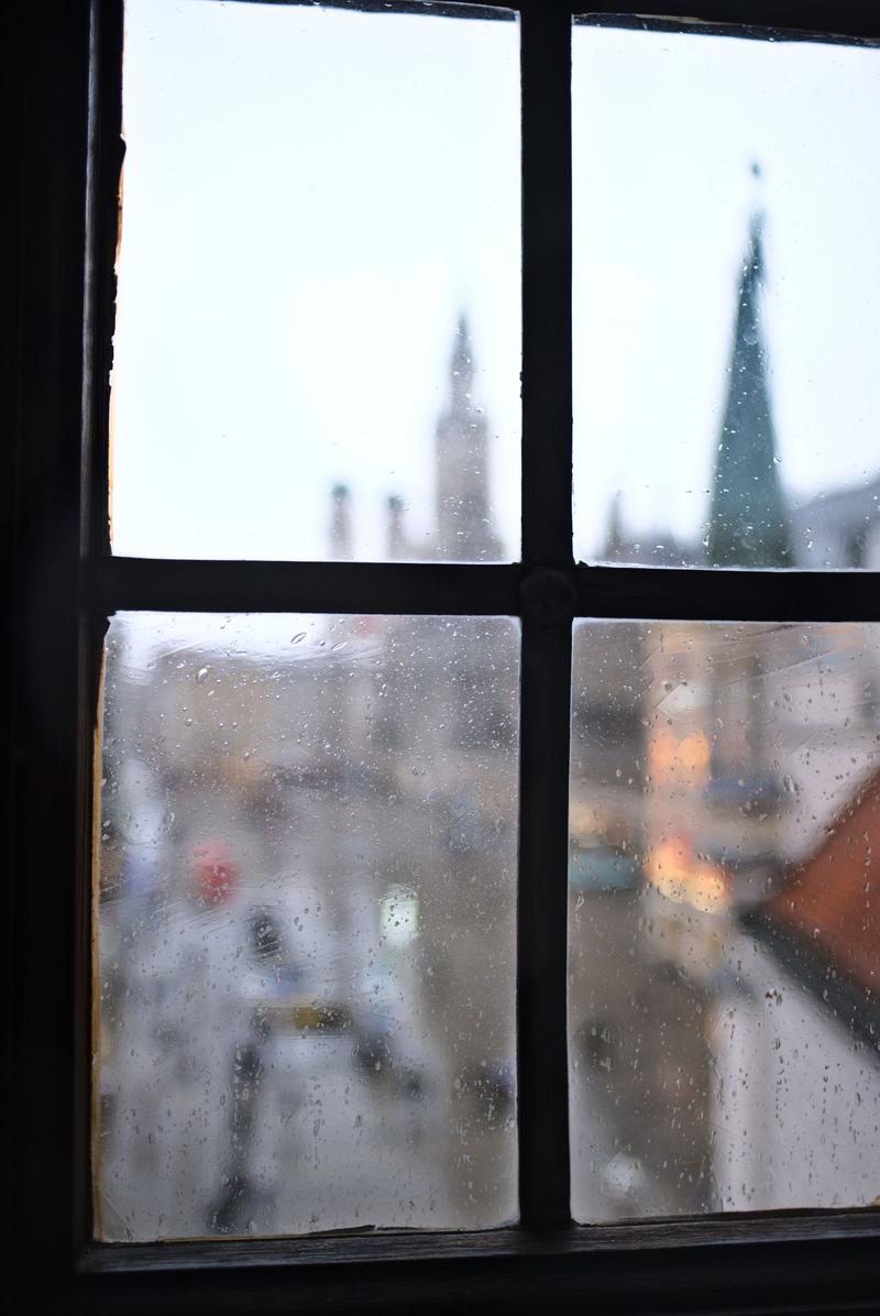 Rathaus-Glockenspiel in Marienplatz viewed through a window in the Spielzeugmuseum (old town hall toy museum), Munich, Germany