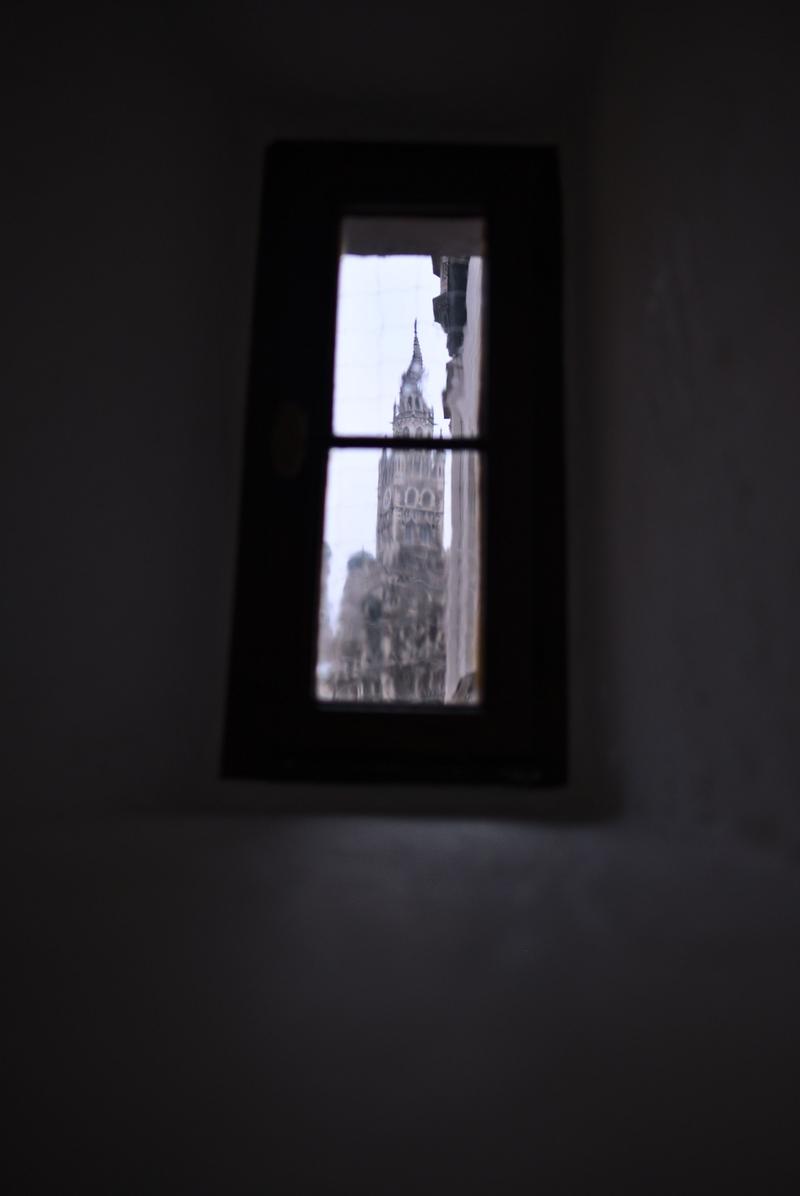 Rathaus-Glockenspiel in Marienplatz viewed through a window in the Spielzeugmuseum (old town hall toy museum), Munich, Germany