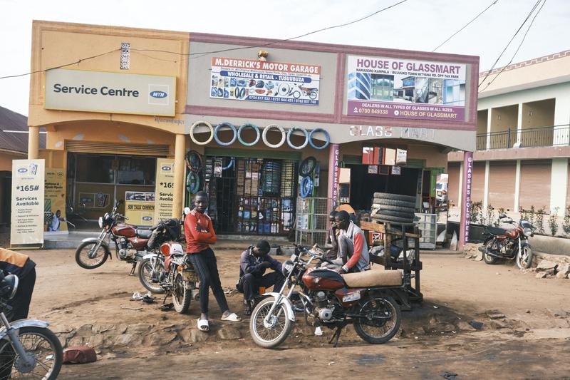 People hanging out in front of stores, Uganda