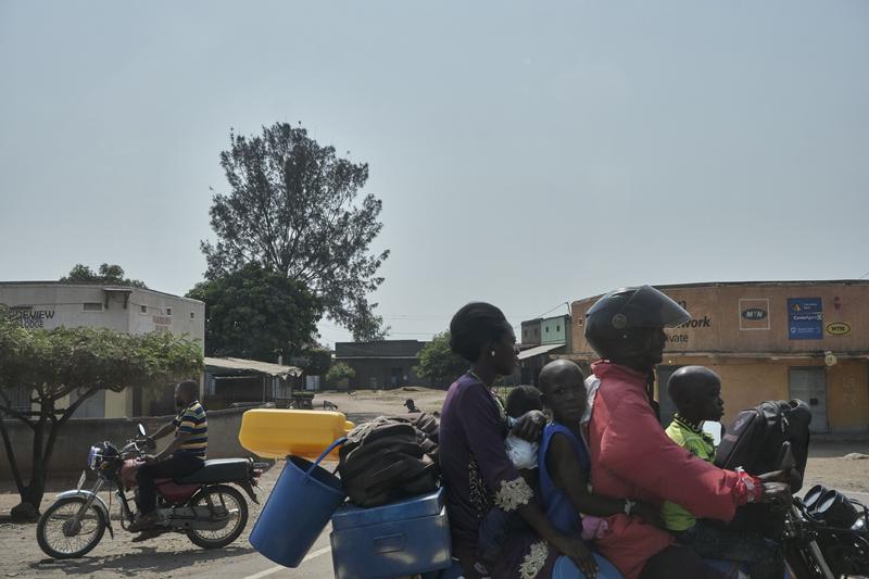 A family of five on a motorcycle, Uganda