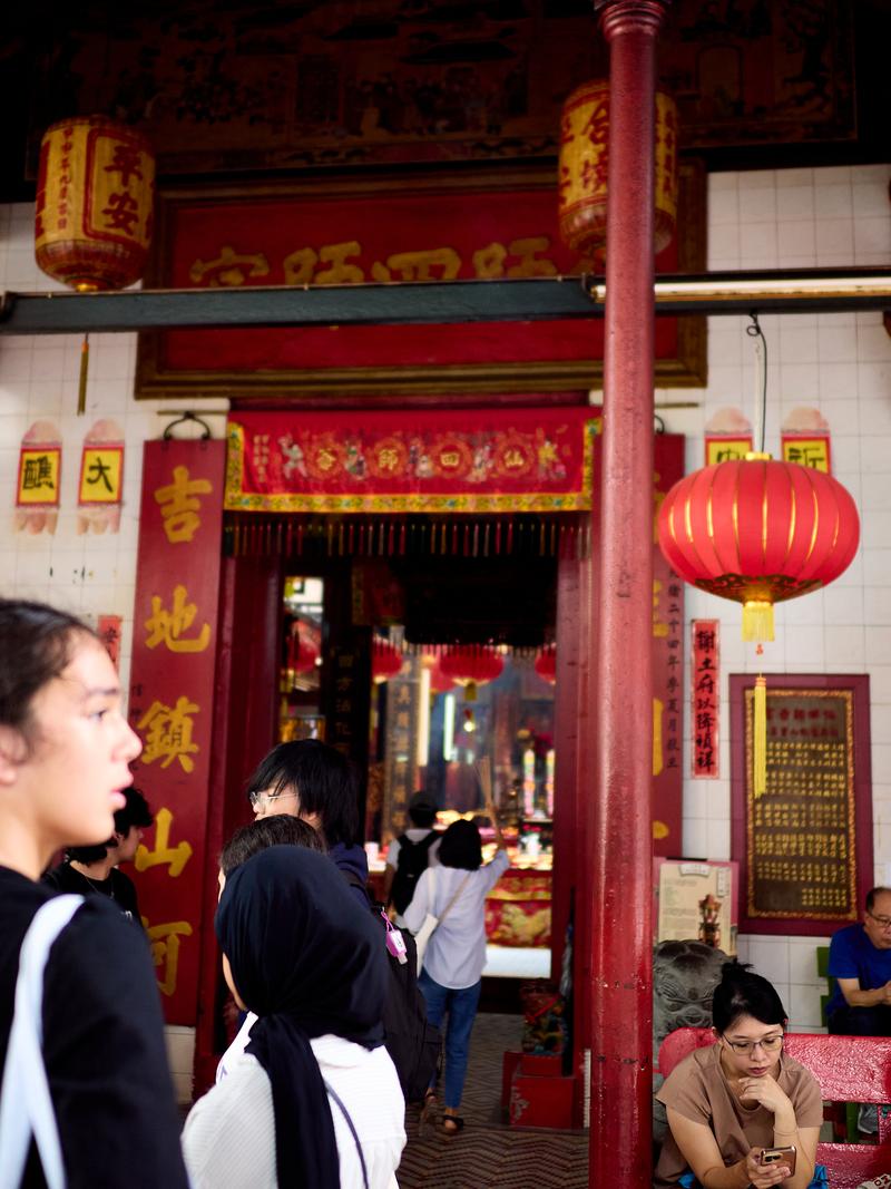 Temple entrance, people in the foreground, Kuala Lumpur, Malaysia