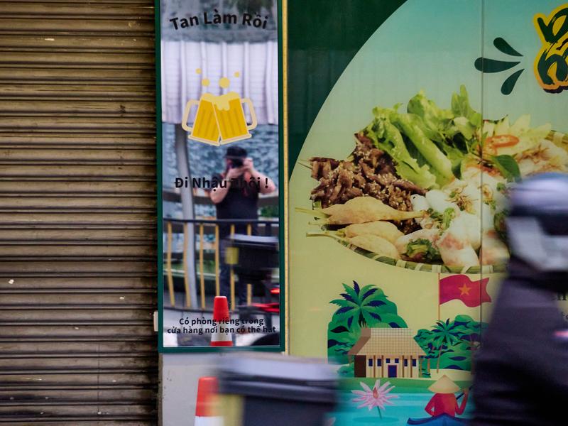 City views, me in a mirrored sign across the street, Kuala Lumpur, Malaysia