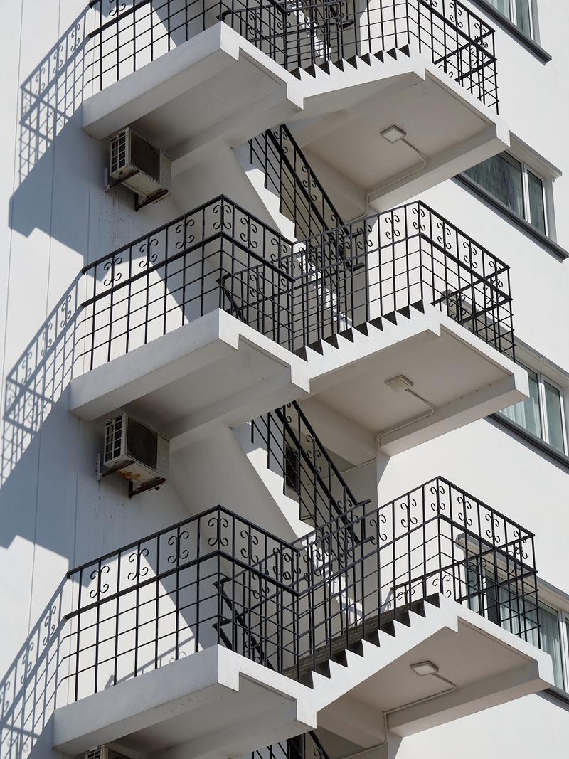 Zoomed in white building, stairwell and light, Penang, Malaysia