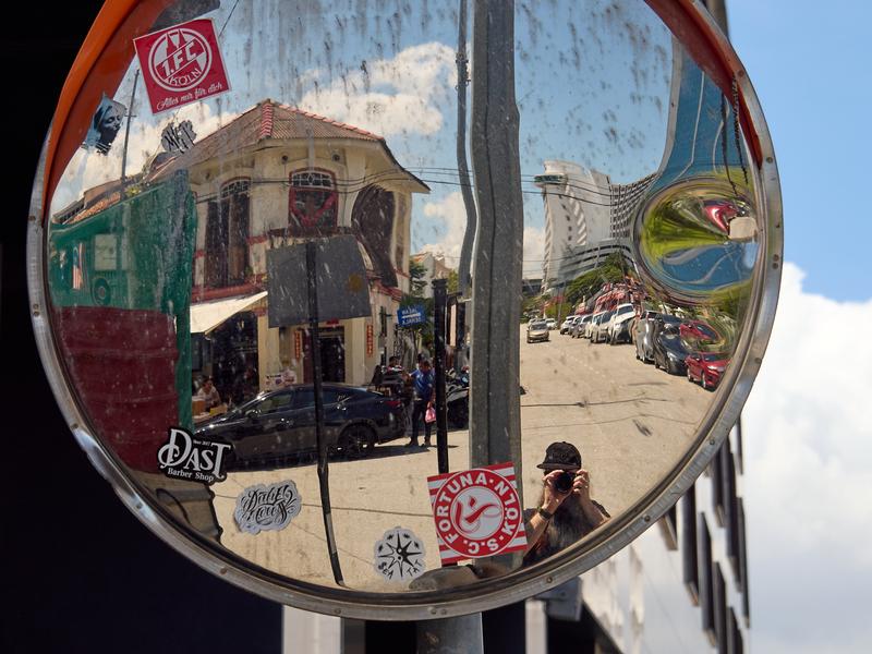 Street corner store and selfie reflection, Penang, Malaysia