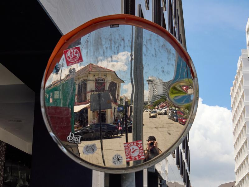 Street corner store and selfie reflection, Penang, Malaysia