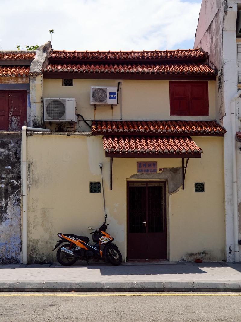 Harsh light, entrance and motorcycle, Penang, Malaysia