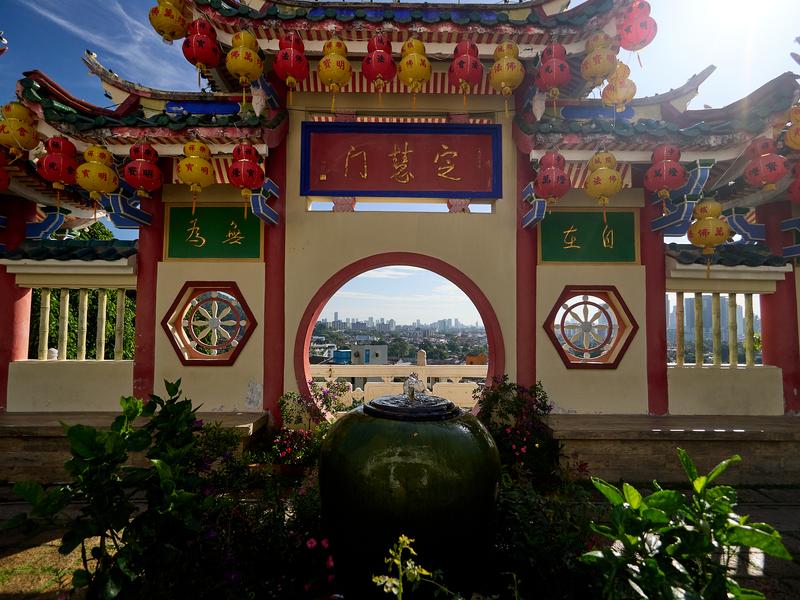 Cityscape through temple architecture, Kek Lok Si Temple, Penang, Malaysia