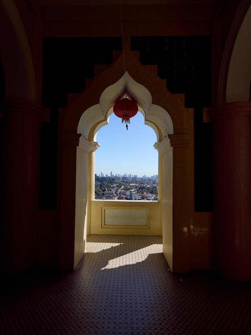 Cityscape through pagoda arch, Kek Lok Si Temple, Penang, Malaysia