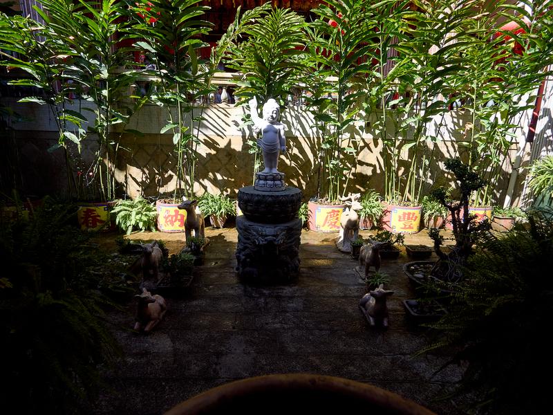 Baby buddah statue surrounded by animal statues, Kek Lok Si Temple, Penang, Malaysia