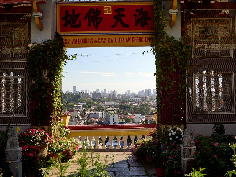Cityscape through temple architecture, Kek Lok Si Temple, Penang, Malaysia