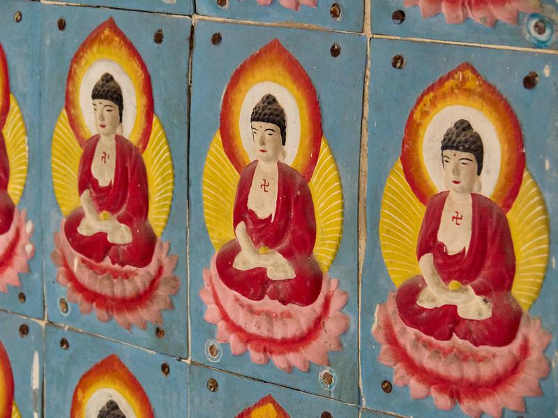 Buddahs lining walls of a temple, Kek Lok Si Temple, Penang, Malaysia