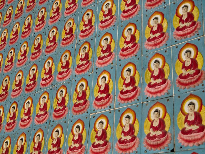 Buddahs lining walls of a temple, Kek Lok Si Temple, Penang, Malaysia