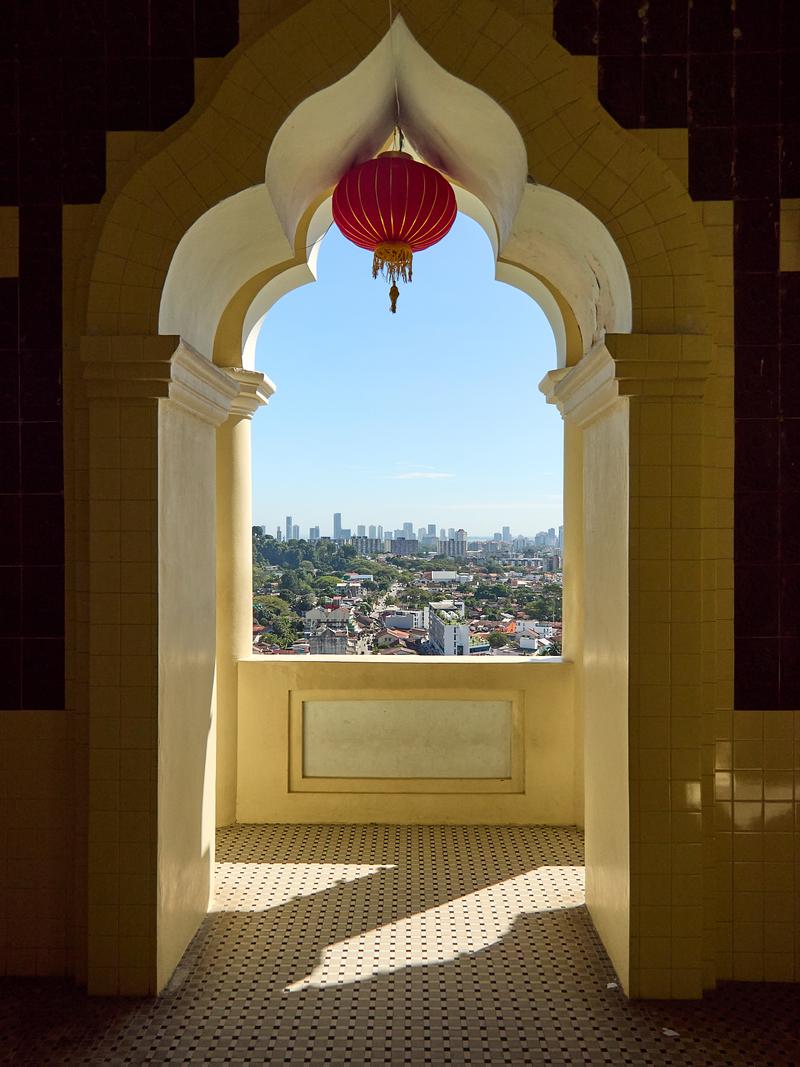 Cityscape through pagoda arch, Kek Lok Si Temple, Penang, Malaysia