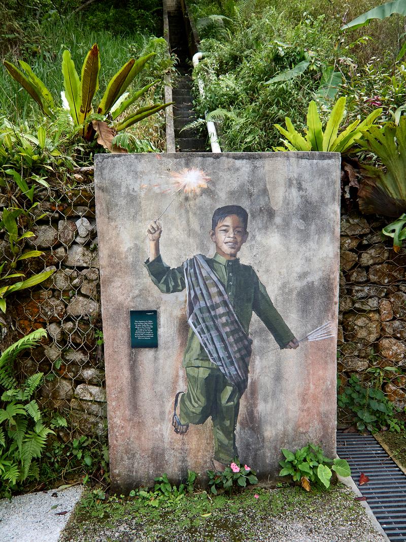 Boy with firecracker artwork, The Habitat, Penang Hill, Penang, Malaysia