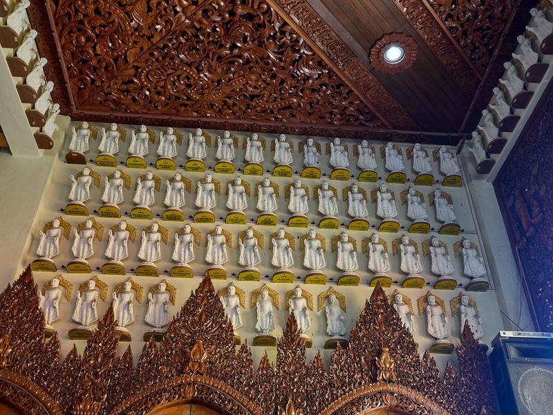 Buddah statues and ornate wood details, Burmese Buddhist Temple, Penang, Malaysia
