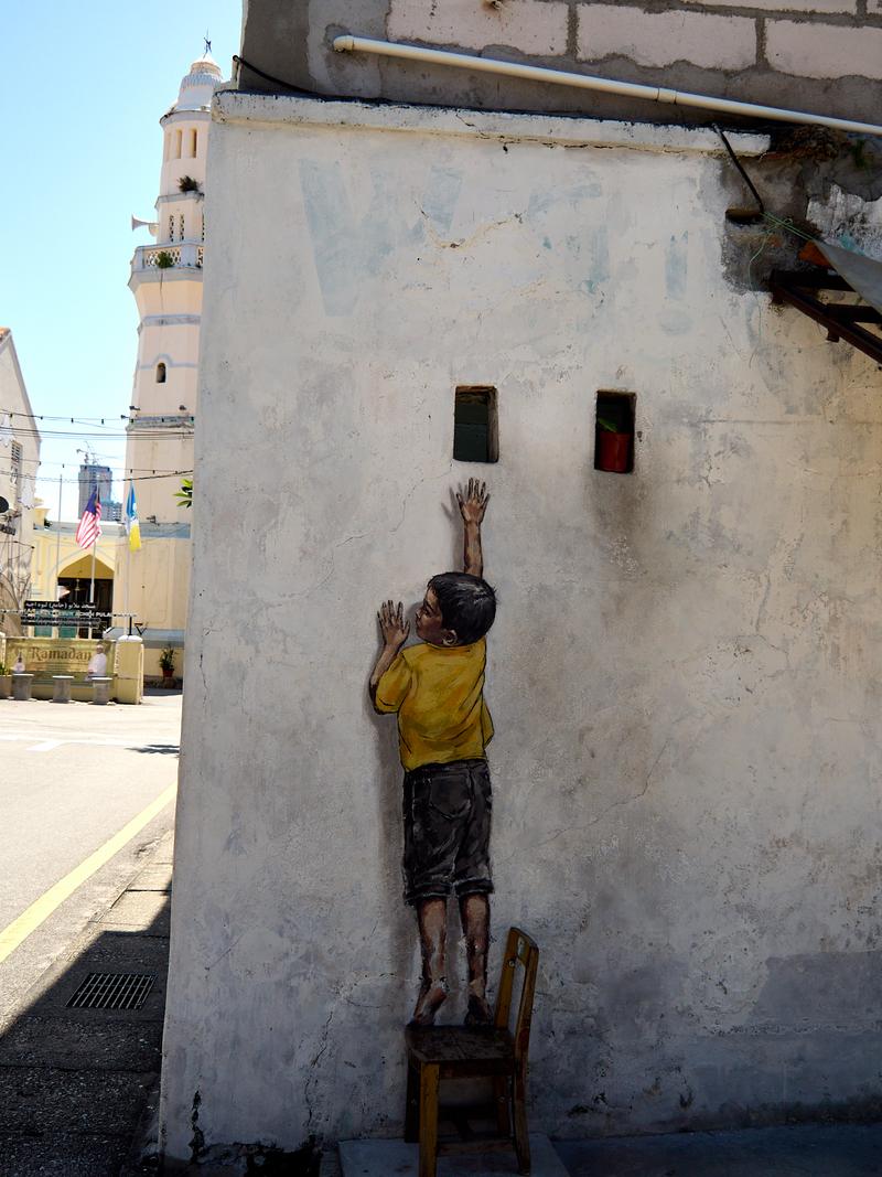 Boy on a chair street art, Penang, Malaysia