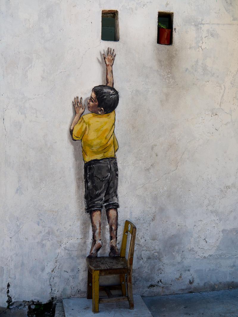 Boy on a chair street art - tighter composition, Penang, Malaysia