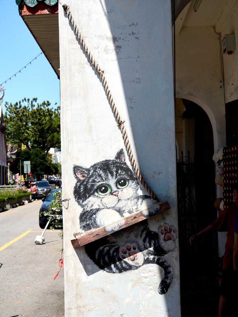 Cat on a swing street art, alternate view, Penang, Malaysia