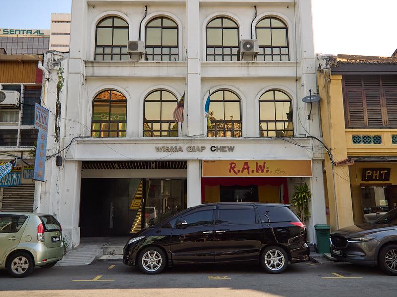 Temple reflected in building windows - neat Lean Giap logo, Penang, Malaysia